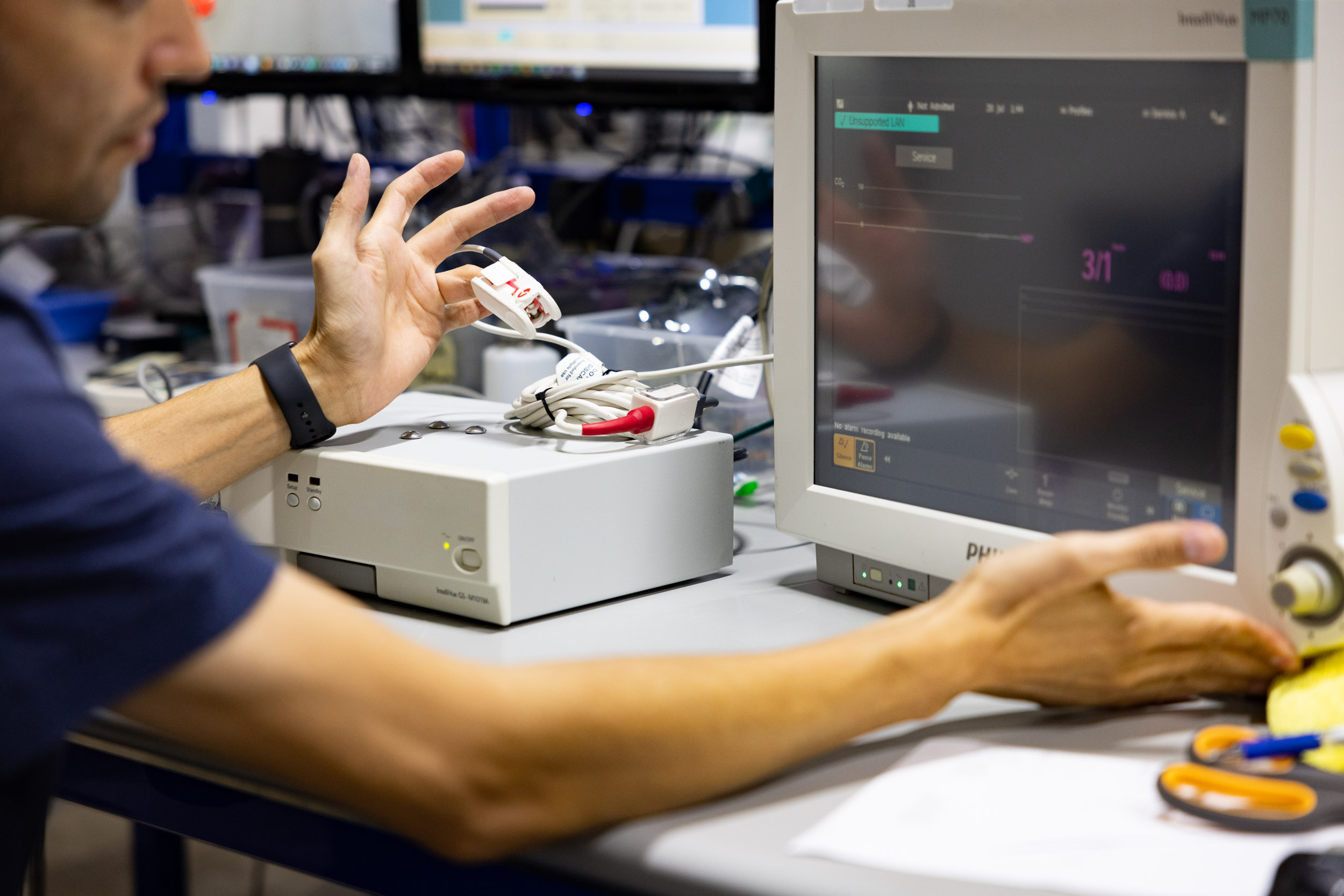 Biomedical technician servicing medical equipment in a hospital